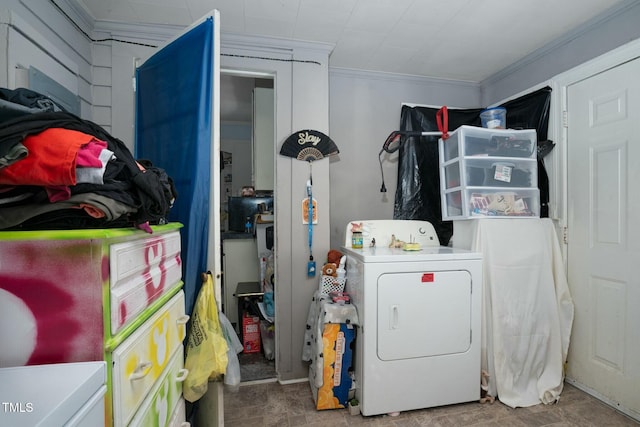 laundry room with laundry area, ornamental molding, and washer / dryer