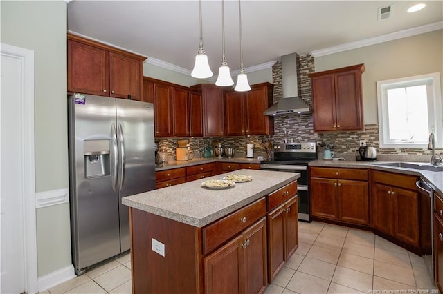 kitchen featuring light tile patterned floors, backsplash, wall chimney exhaust hood, appliances with stainless steel finishes, and a sink