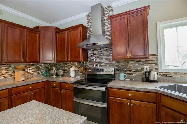 kitchen with tasteful backsplash, double oven range, wall chimney exhaust hood, and ornamental molding