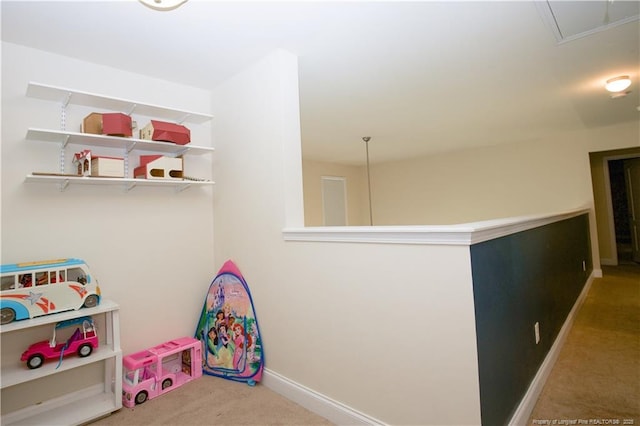 game room with carpet, baseboards, and attic access