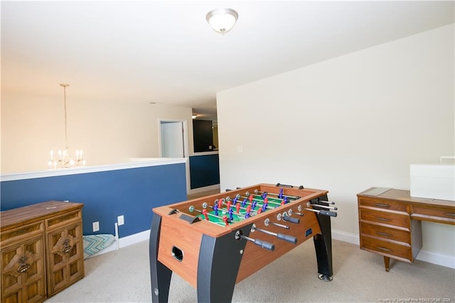 recreation room with a notable chandelier, baseboards, and carpet floors