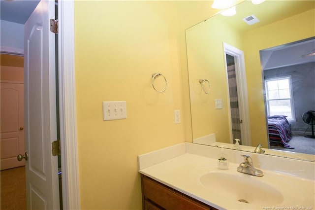 bathroom with vanity and visible vents