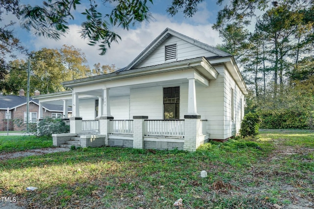 703 Cokey Rd, Rocky Mount, NC 27801 - view of front facade featuring a porch