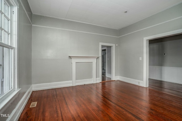 703 Cokey Rd, Rocky Mount, NC 27801 - interior space featuring baseboards, a wainscoted wall, visible vents, and hardwood / wood-style flooring