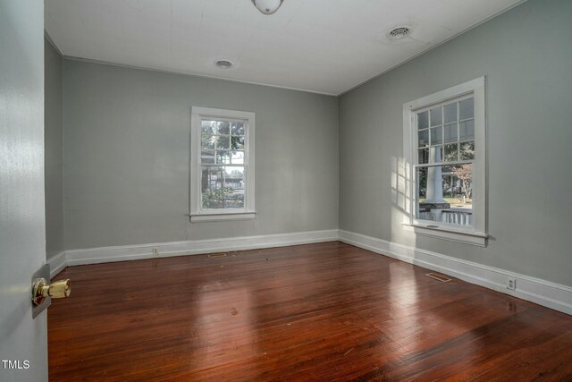 703 Cokey Rd, Rocky Mount, NC 27801 - spare room featuring wood finished floors, baseboards, and visible vents