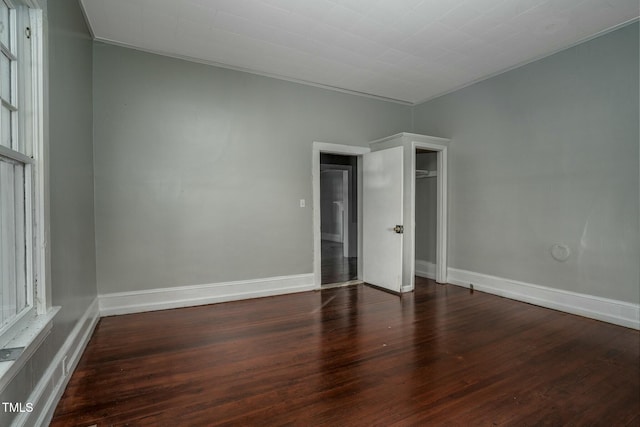 703 Cokey Rd, Rocky Mount, NC 27801 - unfurnished bedroom featuring a closet, baseboards, ornamental molding, and wood finished floors