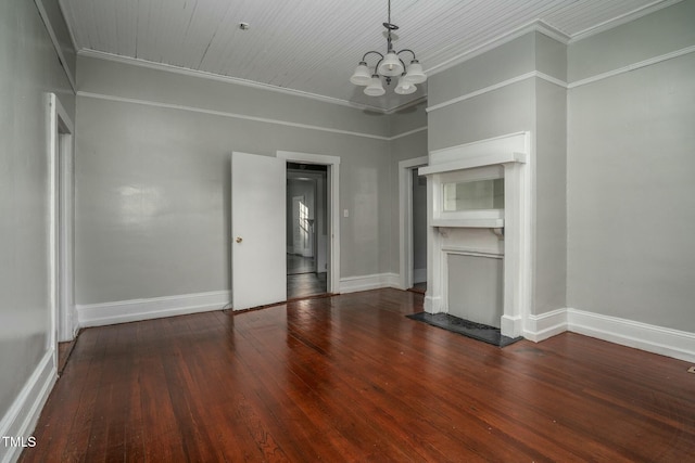 703 Cokey Rd, Rocky Mount, NC 27801 - unfurnished living room with hardwood / wood-style floors, an inviting chandelier, crown molding, and baseboards