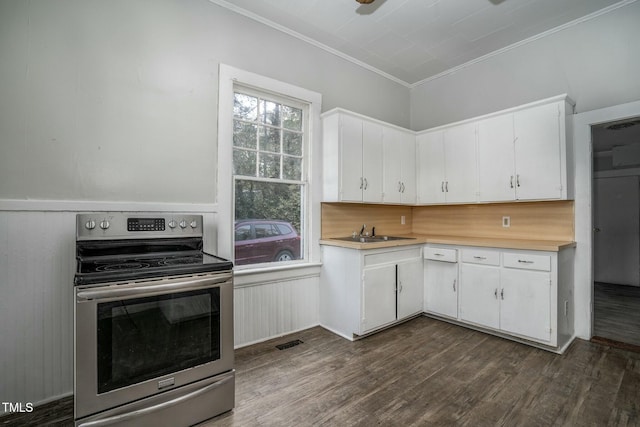 703 Cokey Rd, Rocky Mount, NC 27801 - kitchen with white cabinets, visible vents, light countertops, stainless steel electric range, and dark wood-style floors