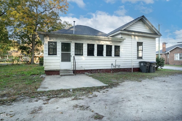 703 Cokey Rd, Rocky Mount, NC 27801 - back of property with entry steps and a patio area