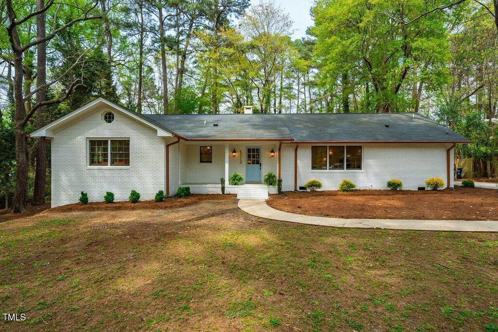 5312 Woodsdale Rd, Raleigh, NC 27606 - single story home featuring brick siding and a chimney