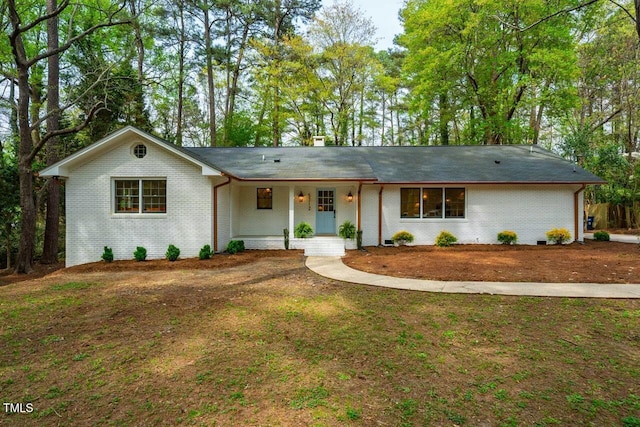 5312 Woodsdale Rd, Raleigh, NC 27606 - single story home featuring brick siding and a chimney