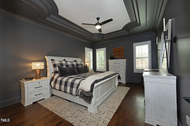 bedroom with ornamental molding, baseboards, multiple windows, and dark wood finished floors