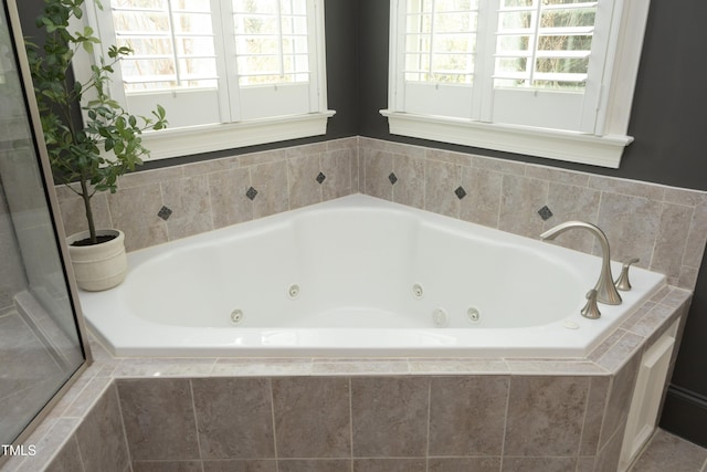 full bath with a jetted tub