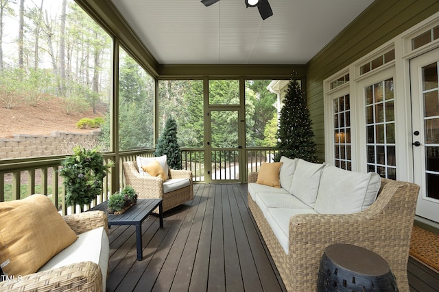 sunroom with an outdoor living space, french doors, and ceiling fan