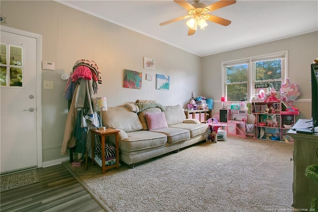 game room with ornamental molding and a ceiling fan