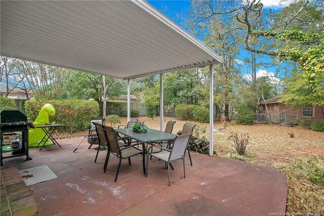 view of patio / terrace featuring a fenced backyard, outdoor dining space, and area for grilling