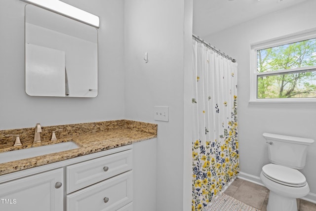 bathroom featuring baseboards, a shower with shower curtain, toilet, vanity, and tile patterned floors