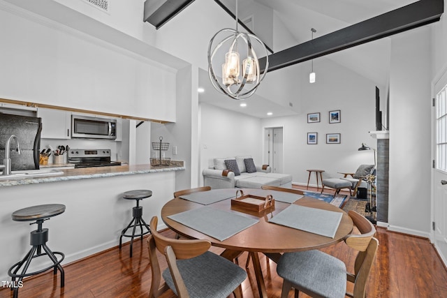 dining area with baseboards, an inviting chandelier, beam ceiling, dark wood-type flooring, and high vaulted ceiling