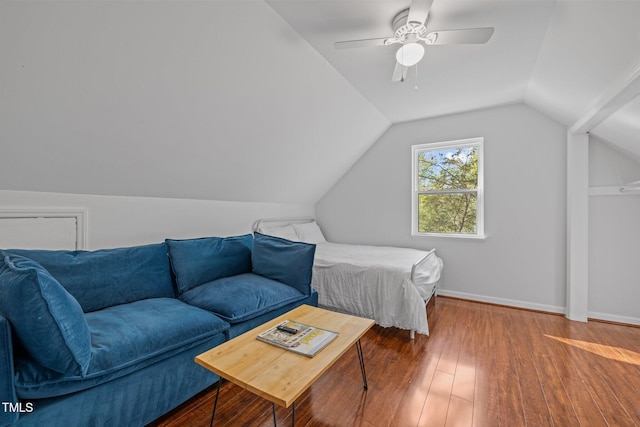 bedroom with ceiling fan, baseboards, lofted ceiling, and hardwood / wood-style flooring