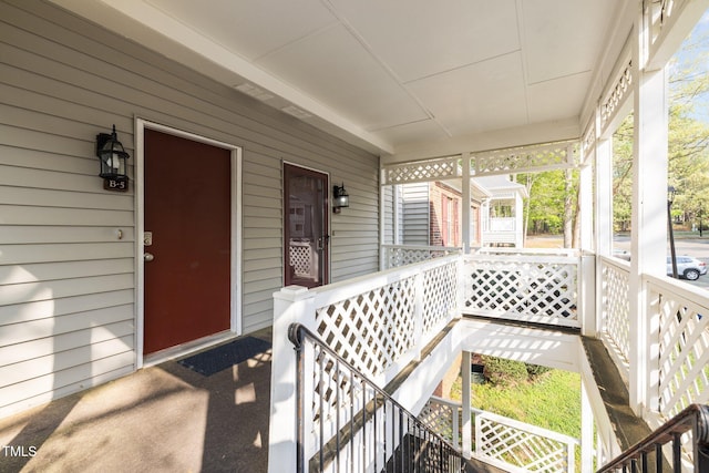 entrance to property featuring a porch