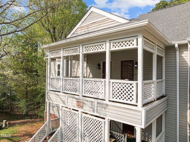 view of property exterior featuring roof with shingles