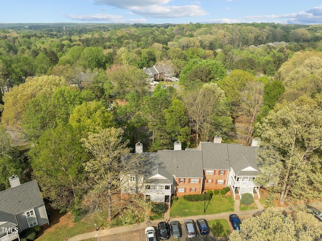 drone / aerial view featuring a view of trees