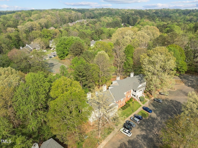 aerial view featuring a wooded view