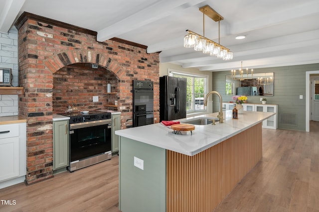 kitchen featuring a sink, beam ceiling, black appliances, and light wood finished floors