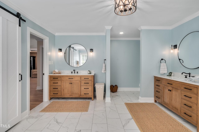 bathroom with baseboards, a sink, crown molding, two vanities, and marble finish floor