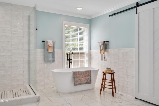 full bathroom featuring tile walls, ornamental molding, a stall shower, a soaking tub, and marble finish floor