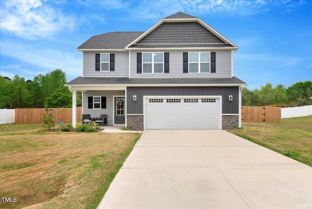 211 Tobacco Barn Dr, Angier, NC 27501 - craftsman house featuring concrete driveway, a garage, stone siding, and fence