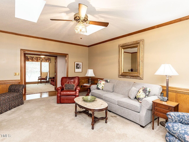 422 Old Scarborough Ln, Garner, NC 27529 - living area with ornamental molding, light carpet, ceiling fan, and wainscoting