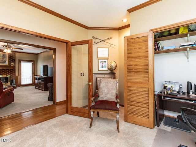 422 Old Scarborough Ln, Garner, NC 27529 - sitting room with light carpet, a fireplace, crown molding, and a ceiling fan