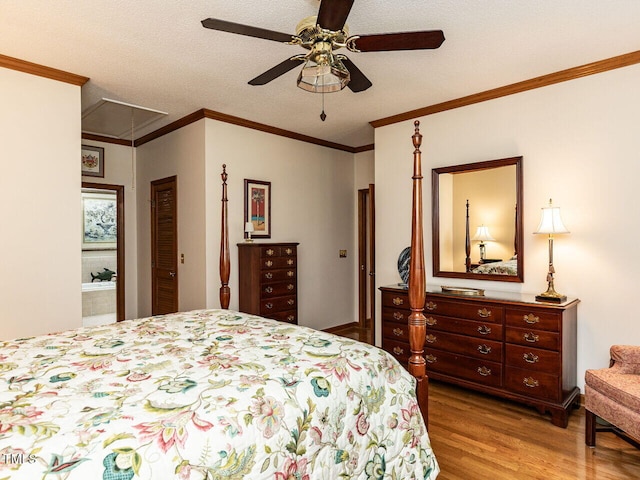 422 Old Scarborough Ln, Garner, NC 27529 - bedroom featuring ornamental molding, ceiling fan, a textured ceiling, attic access, and wood finished floors
