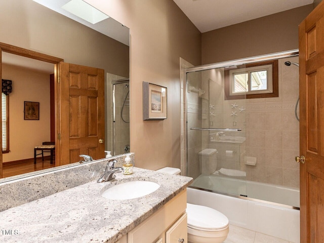 422 Old Scarborough Ln, Garner, NC 27529 - full bath with toilet, tile patterned floors, vanity, and combined bath / shower with glass door