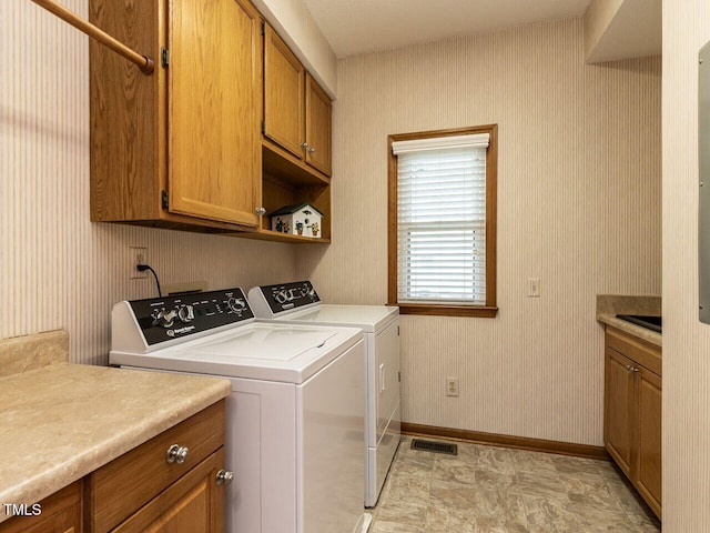 422 Old Scarborough Ln, Garner, NC 27529 - laundry room with wallpapered walls, separate washer and dryer, cabinet space, and visible vents