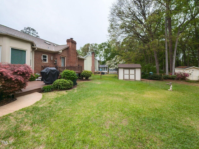 422 Old Scarborough Ln, Garner, NC 27529 - view of yard with a deck, an outbuilding, and a storage unit