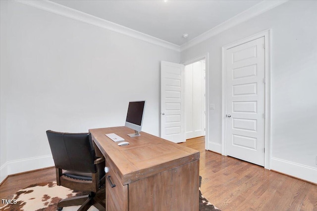office with ornamental molding, baseboards, and wood finished floors