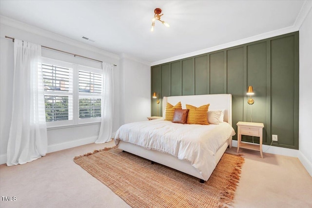 bedroom featuring visible vents, ornamental molding, baseboards, and carpet floors