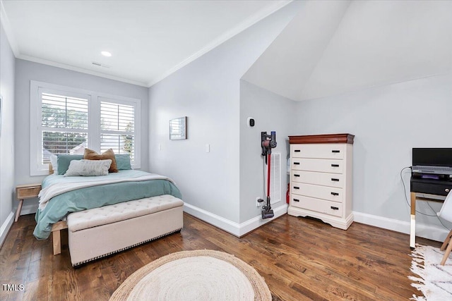 bedroom with visible vents, ornamental molding, baseboards, and wood finished floors