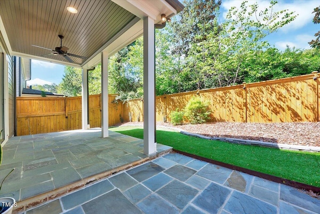 view of patio / terrace with a fenced backyard and a ceiling fan