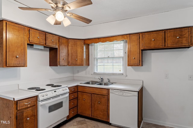kitchen featuring light countertops, a ceiling fan, a sink, white appliances, and brown cabinetry