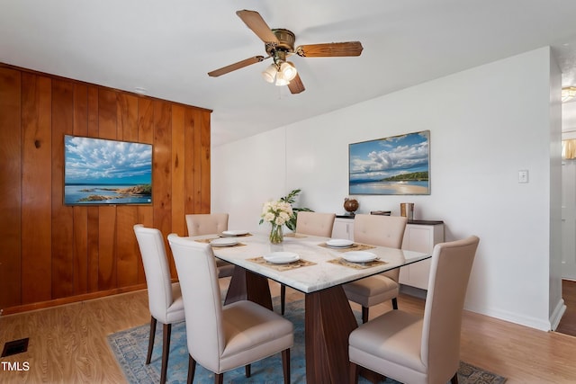 1813 Grady Dr, Durham, NC 27712 - dining room featuring light wood-style floors, a ceiling fan, and baseboards