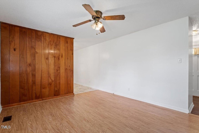 1813 Grady Dr, Durham, NC 27712 - empty room with wood finished floors and a ceiling fan
