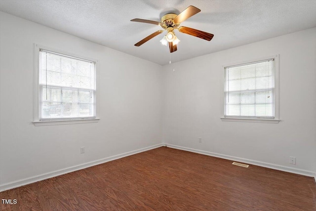 1813 Grady Dr, Durham, NC 27712 - spare room with wood finished floors, plenty of natural light, ceiling fan, and a textured ceiling