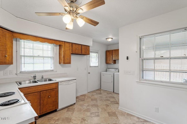 1813 Grady Dr, Durham, NC 27712 - kitchen featuring dishwasher, separate washer and dryer, brown cabinetry, light countertops, and a ceiling fan