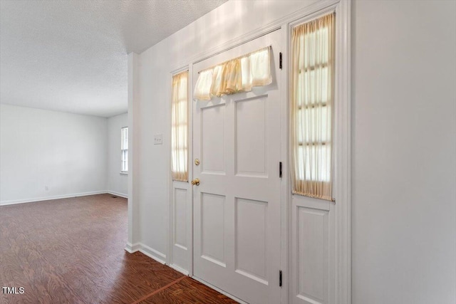1813 Grady Dr, Durham, NC 27712 - entryway featuring dark wood-style flooring and a textured ceiling