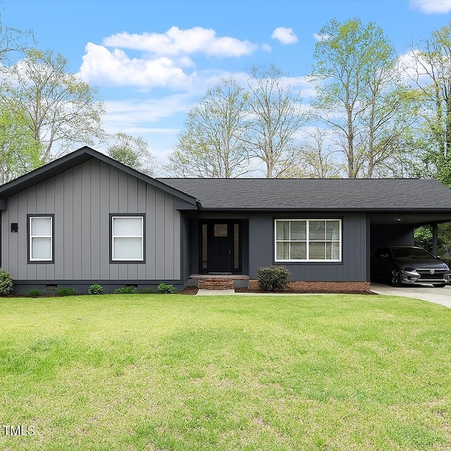 1813 Grady Dr, Durham, NC 27712 - ranch-style house featuring crawl space, an attached carport, a front lawn, and board and batten siding