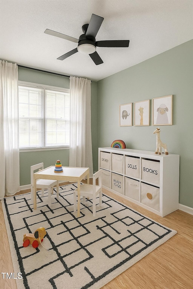 1813 Grady Dr, Durham, NC 27712 - rec room with a ceiling fan and wood finished floors