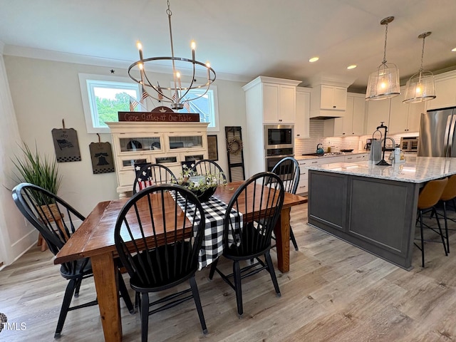 6521 Camellia Creek Dr, Raleigh, NC 27603 - dining room with a chandelier, light wood-style floors, recessed lighting, baseboards, and ornamental molding